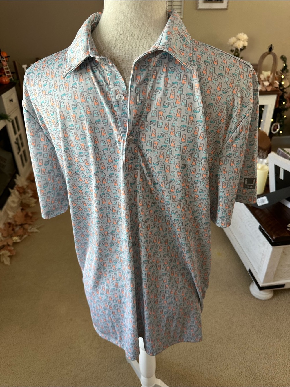 Men's Huk Short Sleeve Polo in Light Blue with Coral Accent